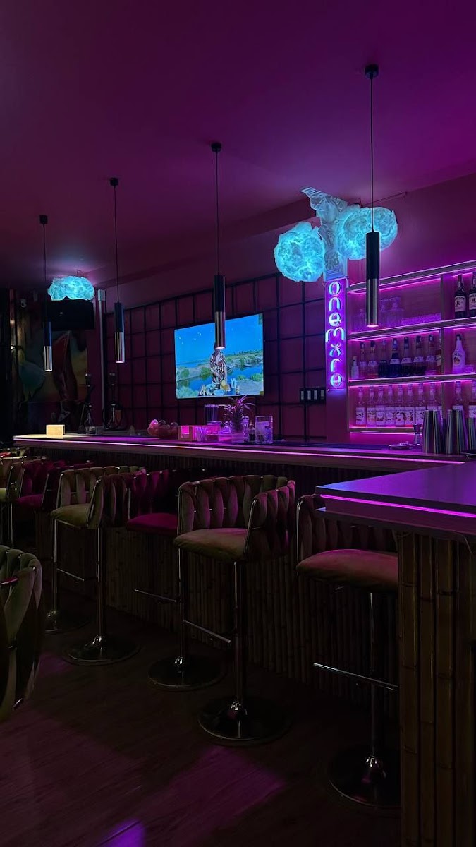 The OneMore bar under magenta lighting